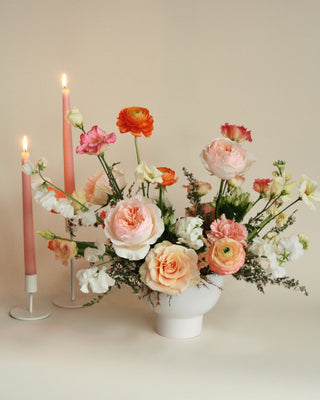 Mother's Day arrangement with peach, orange, white, and pink flowers
