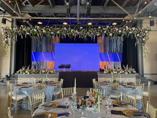 A large hanging stage statement at a corporate Sanford Hospital event at The Armory in Moorhead, MN